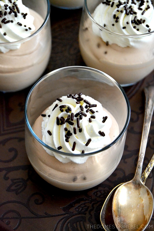Bailey's Mousse in small jars with silver spoons on metal tray