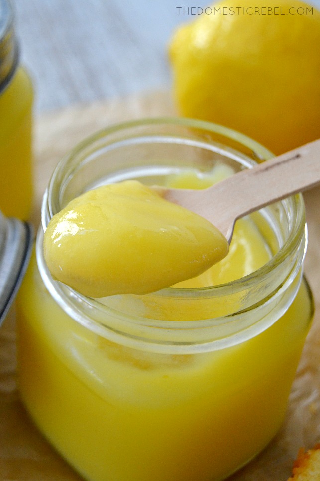 Jar of lemon curd with spoon resting on it
