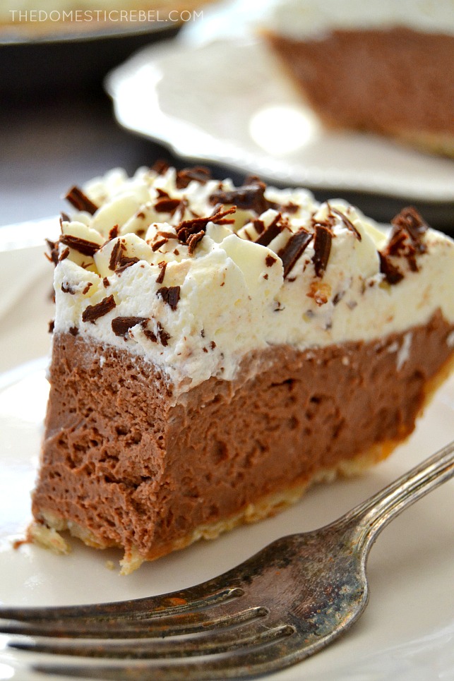 French Silk Pie on white plate with bite missing and a fork