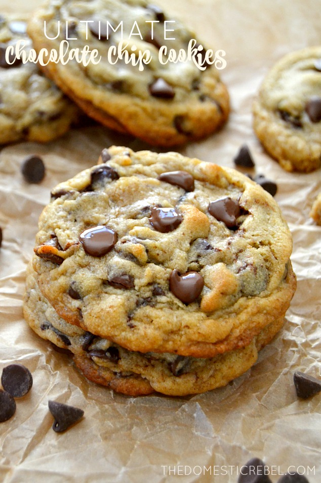 Ultimate Chocolate Chip Cookies arranged on parchment with chocolate chips