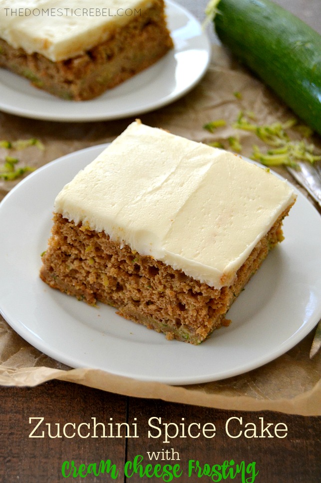 Zucchini Cake slices arranged on white plates on parchment with zucchini in background