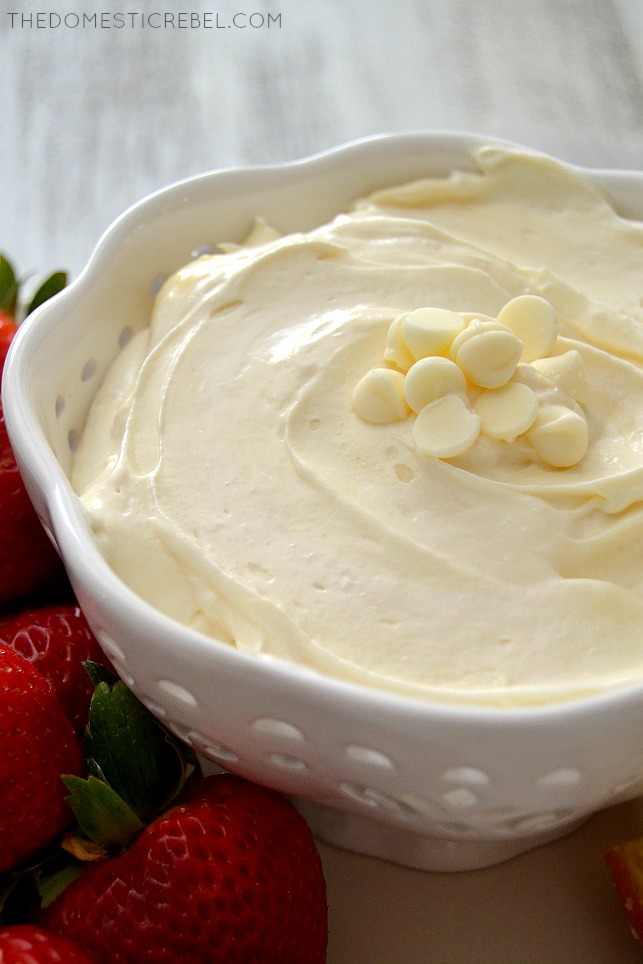 Closeup of White Chocolate Marshmallow Dip in white bowl with strawberries