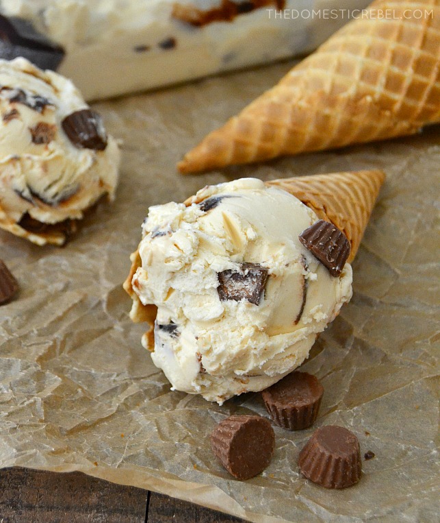 PB Cup Ice Cream in cones on parchment paper with mini PB cups