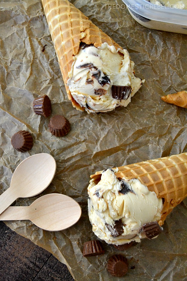 PB Cup Ice Cream in cones on parchment with wooden spoons and PB cups