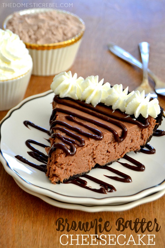 Brownie Batter Cheesecake on white plate with dishes and forks in background