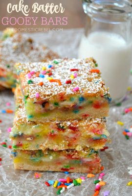 These Cake Batter Gooey Bars are AMAZING. Gooey, chewy and studded with rainbow sprinkles, they taste JUST like cake batter and are so easy to make!