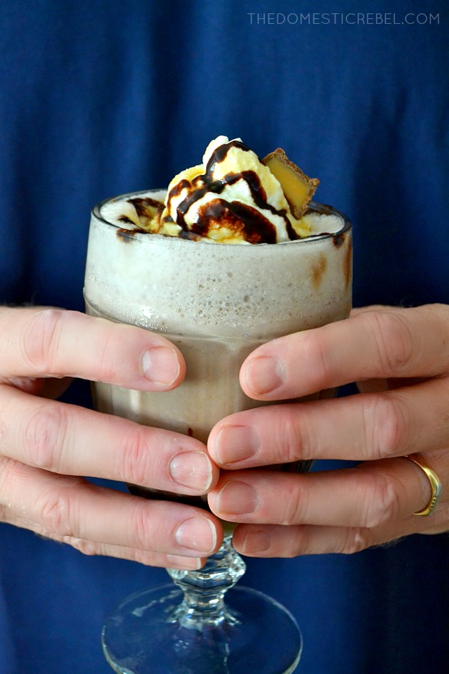 Caramel Frozen Hot Chocolate in glass held by author's hands