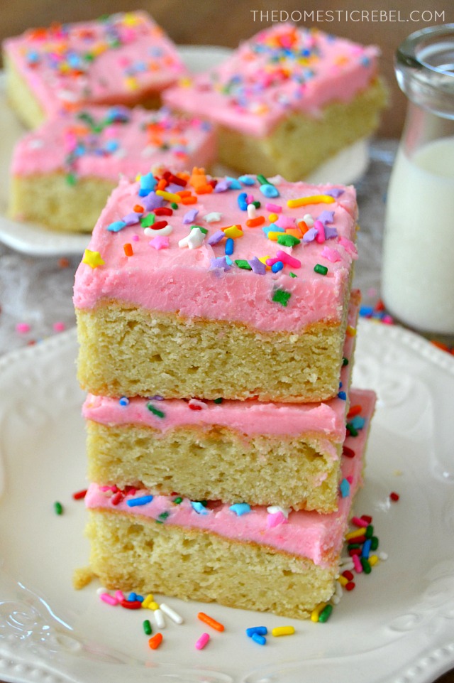 Lofthouse Sugar Cookie Bars stacked high on white plate with milk