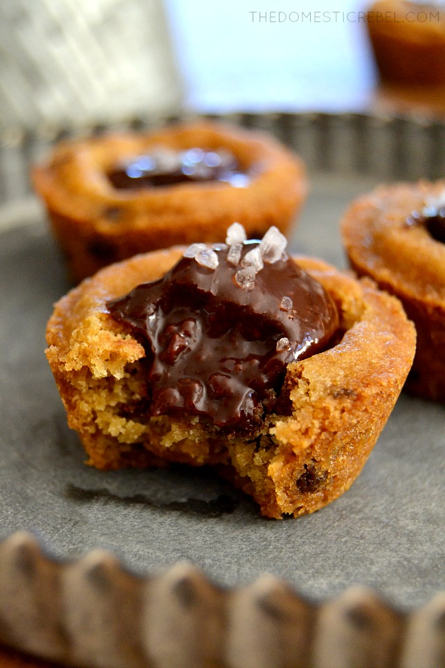 Closeup of Salted Ganache Cookie Cups with bite missing on metal tray