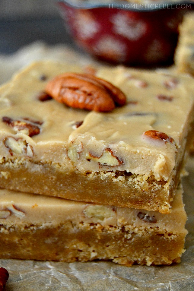 Pecan Praline Blondies stacked up close on parchment