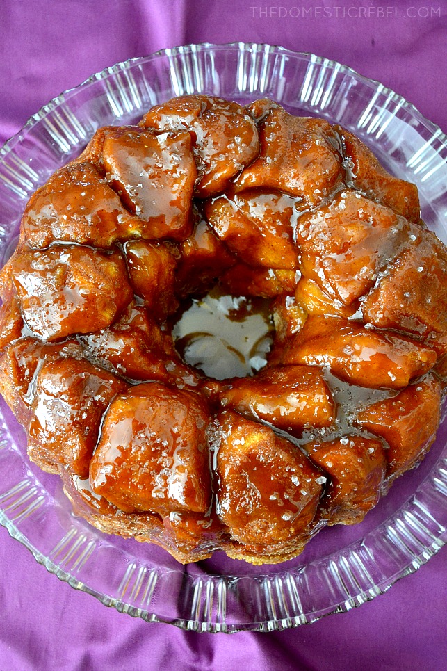 Salted Caramel Monkey Bread on glass plate with purple towel