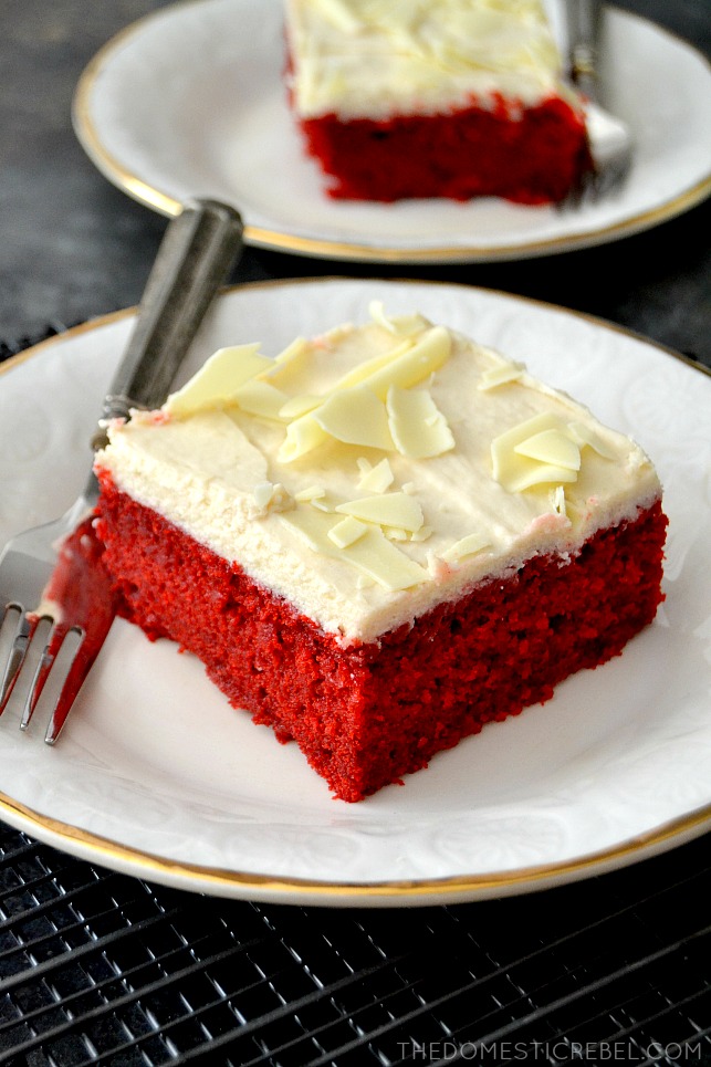 red velvet cake on white plates with forks