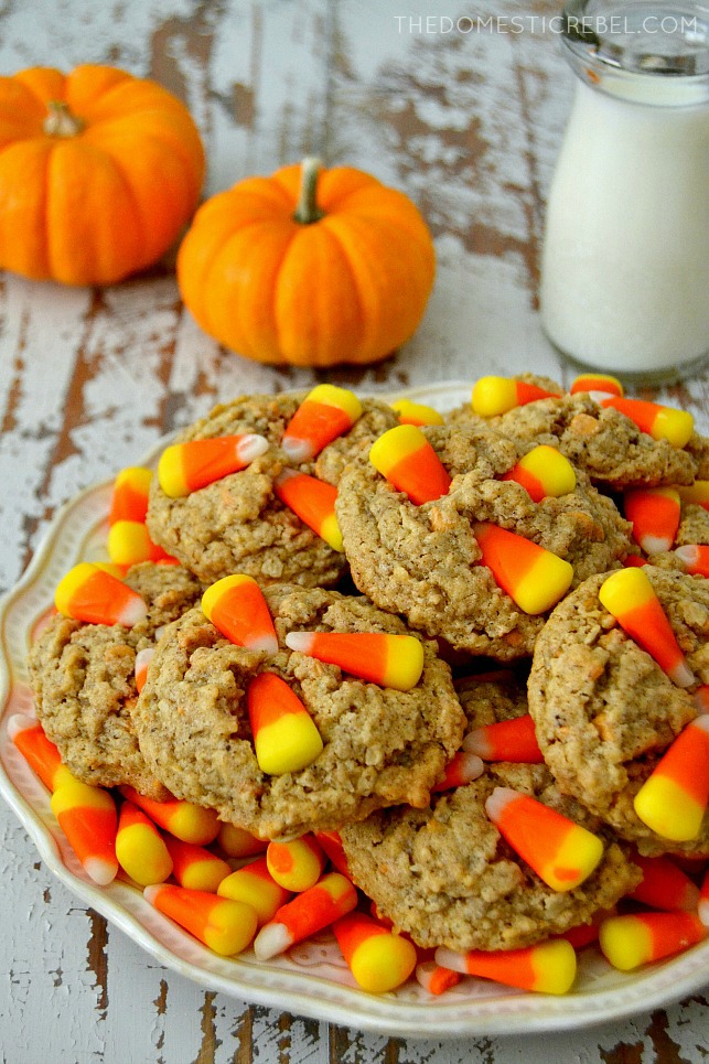 candy corn oatmeal scotchies on plate with candy corns, pumpkins and a milk glass