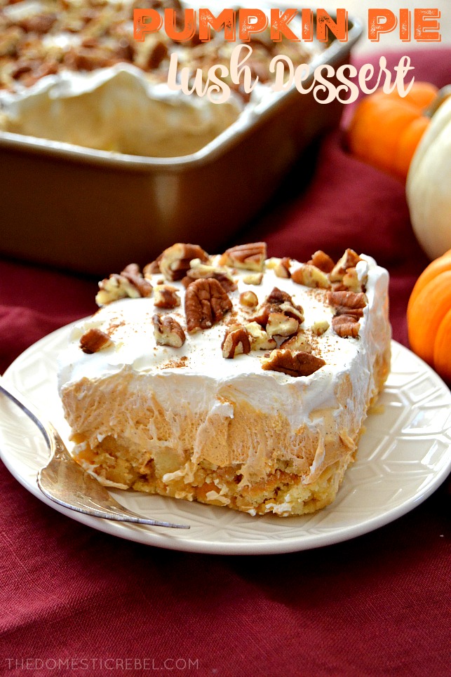 Pumpkin Pie Lush Dessert slice on white plate with fork and pumpkins