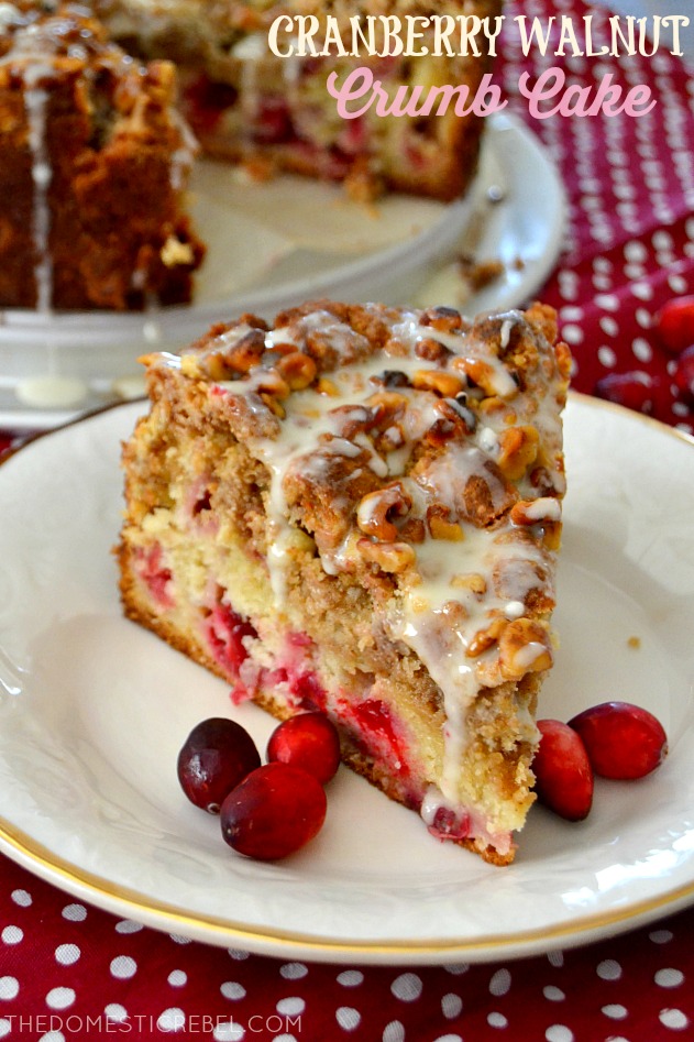 cranberry walnut crumb cake on white plate with cranberries