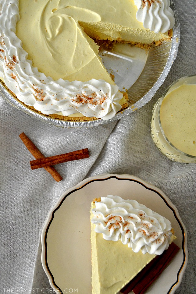 Eggnog Cream Pie in pie pan and on plates with cinnamon sticks and eggnog