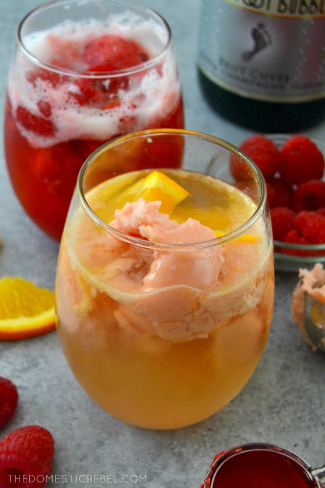sorbet champagne floats with orange slices and fresh raspberries