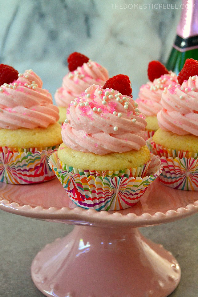 pink champagne cupcakes on pink cake stand