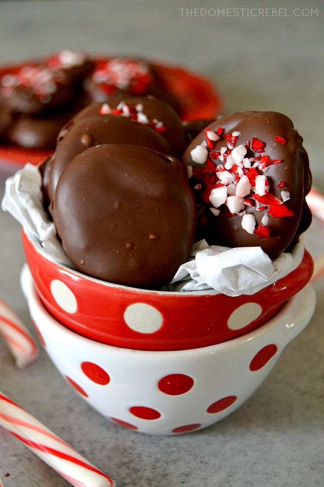 peppermint patties in red and white bowls with candy canes