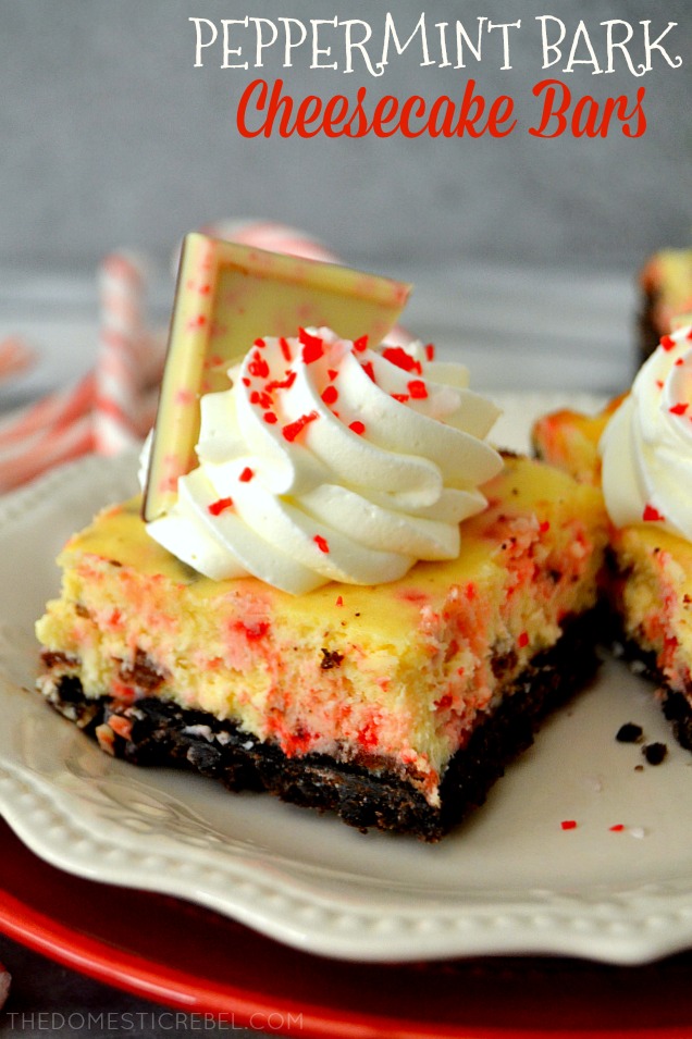 peppermint bark cheesecake bars on white and red plates with candy canes