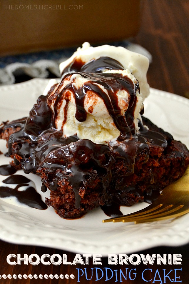 Slice of chocolate brownie pudding cake topped with ice cream and chocolate drizzle