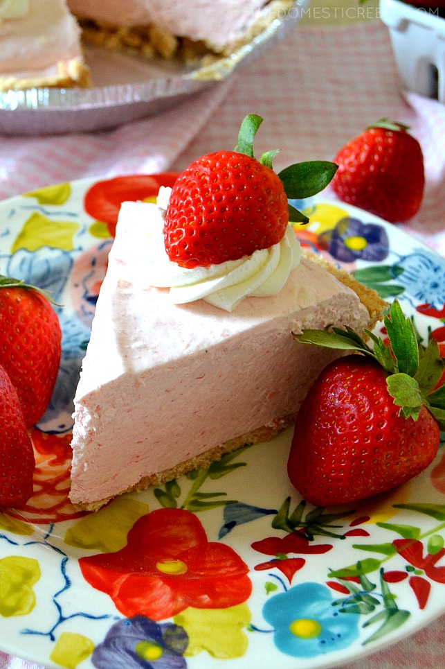 A SLICE OF FROZEN STRAWBERRY DAIQUIRI PIE ON A COLORFUL PLATE.