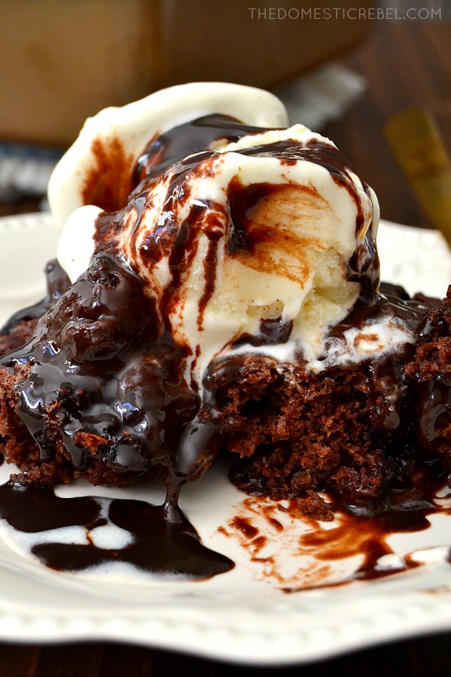 SLICE OF CHOCOLATE BROWNIE PUDDING CAKE WITH ICE CREAM ON TOP.