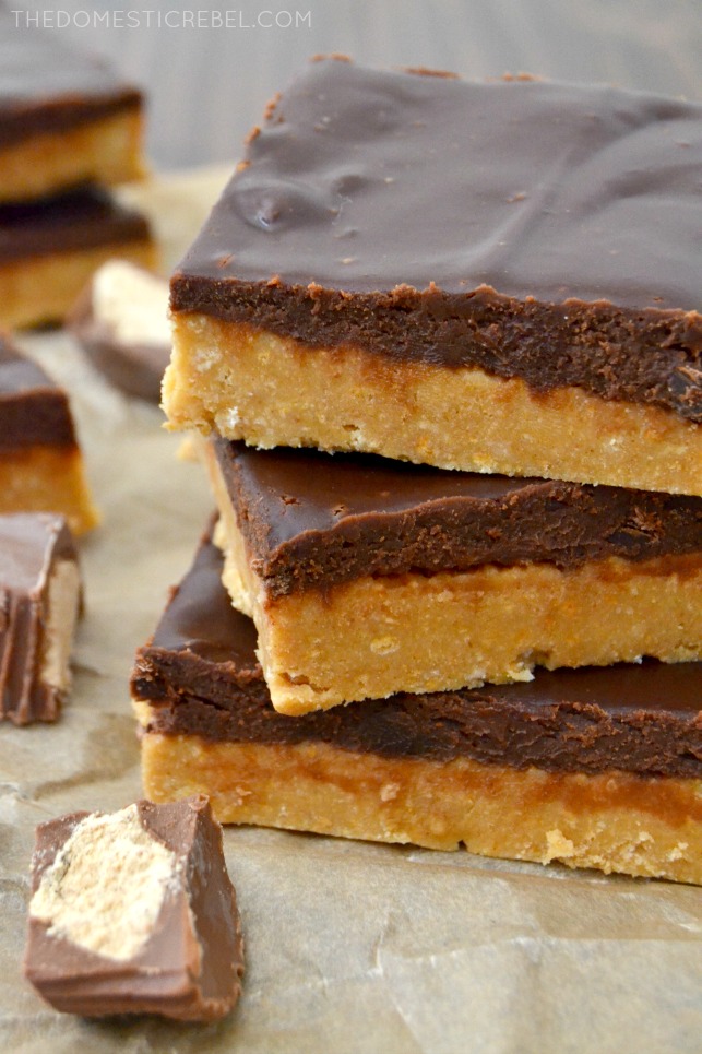 CLOSE UP OF THREE REESES PEANUT BUTTER CUP BARS STACKED.