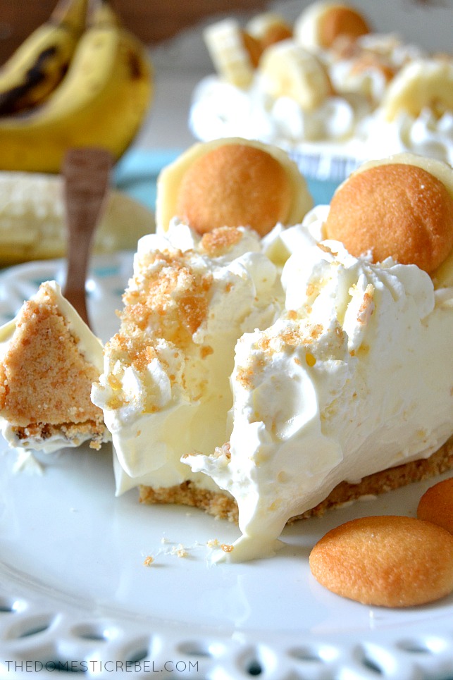 A BITE TAKEN OUT OF A SLICE OF BANANA PUDDING PIE