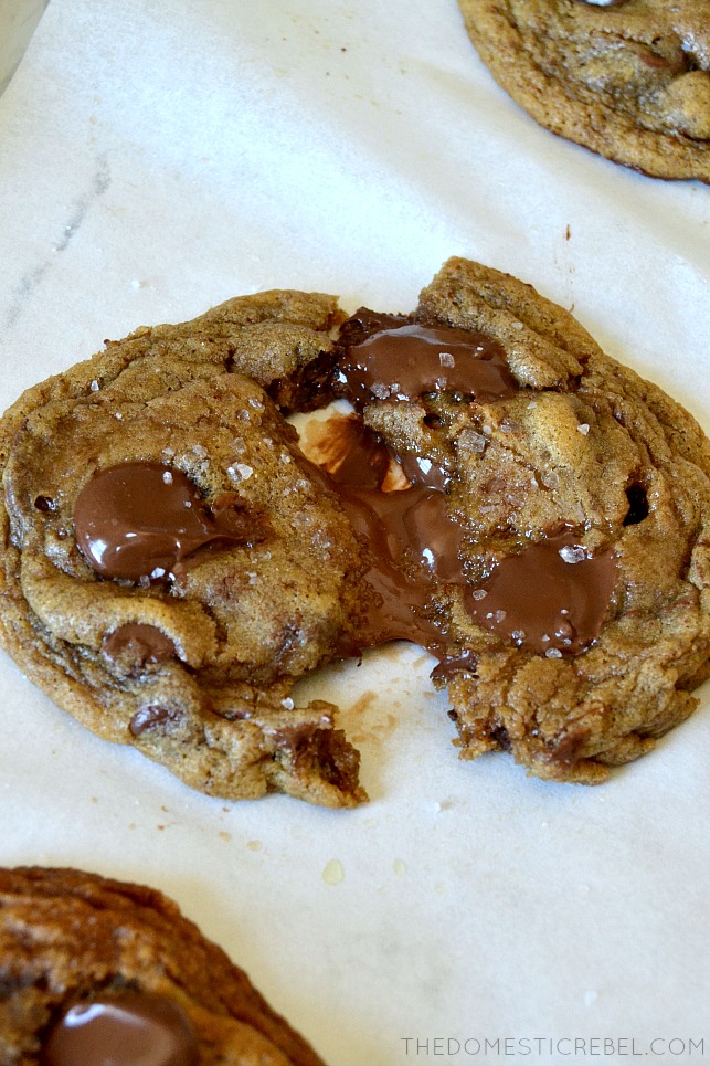 CHOCOLATE CHIP COOKIE CUT IN HALF TO SHOW NUTELLA INSIDE