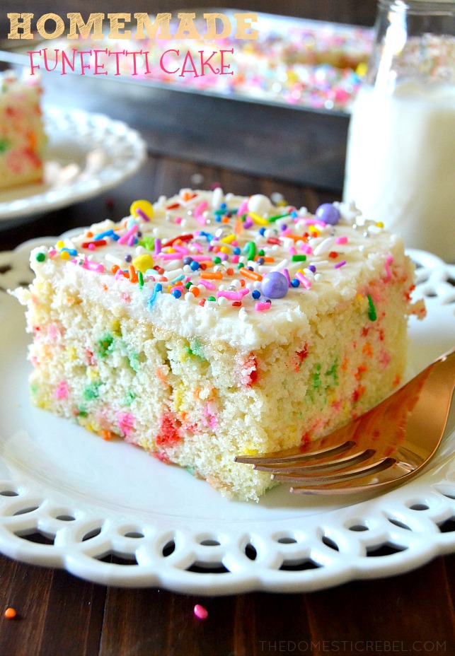ONE SLICE OF HOMEMADE FUNFETTI CAKE ON A WHITE PLATE