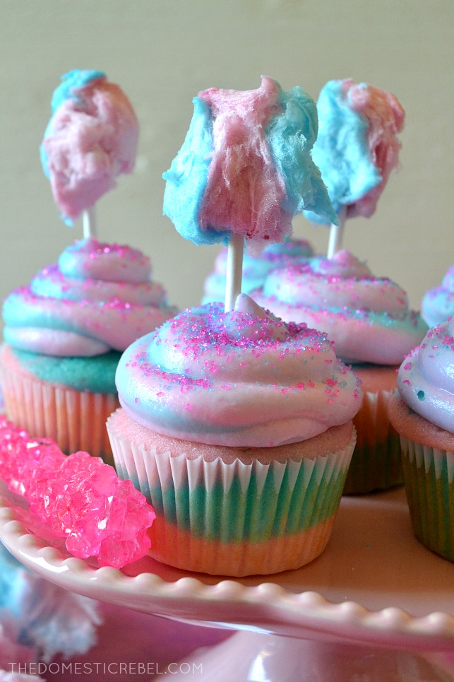 COTTON CANDY CUPCAKES ARRANGED ON A PINK CAKE STAND