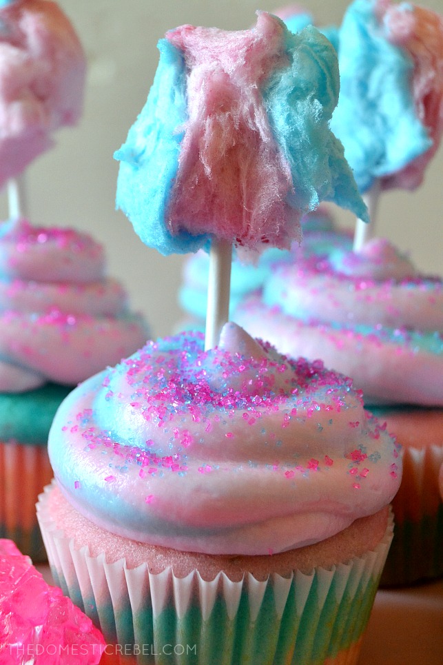 COTTON CANDY CUPCAKE WITH A PIECE OF COTTON CANDY ON TOP
