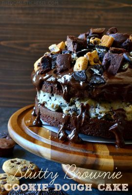 This Slutty Brownie Cookie Dough Cake takes the Pinterest favorite to a whole new level! Two fudge brownie "cake" layers sandwiched around egg-free chocolate chip Oreo cookie dough, topped with smooth chocolate ganache and bite-size morsels of brownies, chocolate chip cookies, and Oreos! So decadent, impressive, and OUTRAGEOUS!