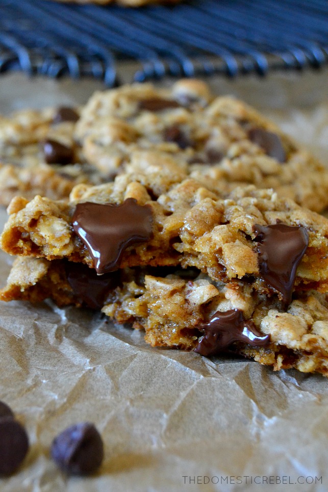 OATMEAL CHOCOLATE CHIP COOKIE SPLIT IN HALF WITH GOOEY CHOCOLATE CHIPS
