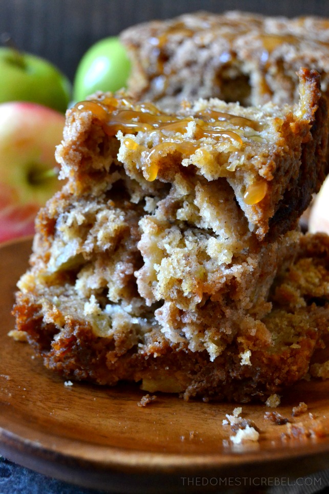A SLICE OF APPLE BREAD SLICED IN HALF, STACKED ON TOP OF EACH OTHER