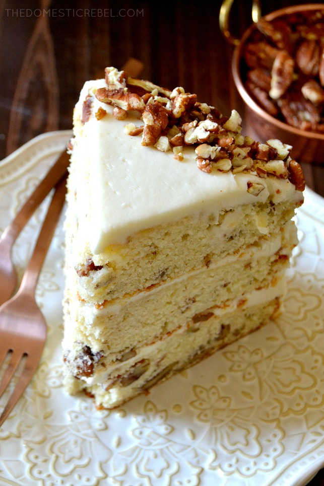 slice of butter pecan layer cake on an ornate white plate