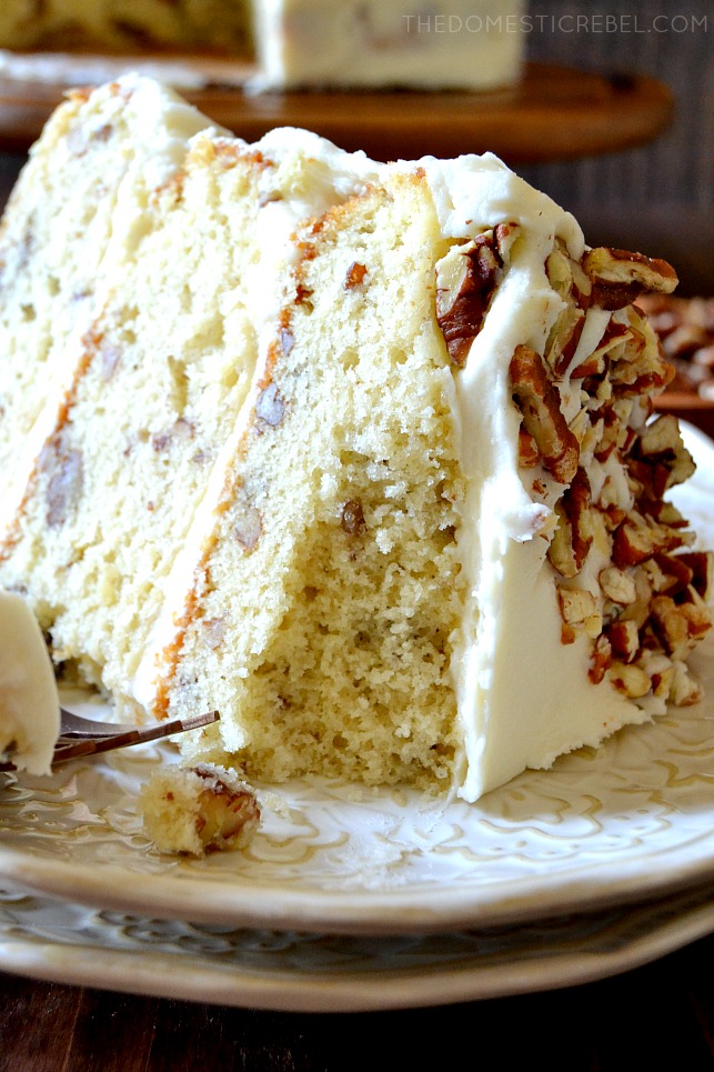 slice of butter pecan cake on its side missing a bite