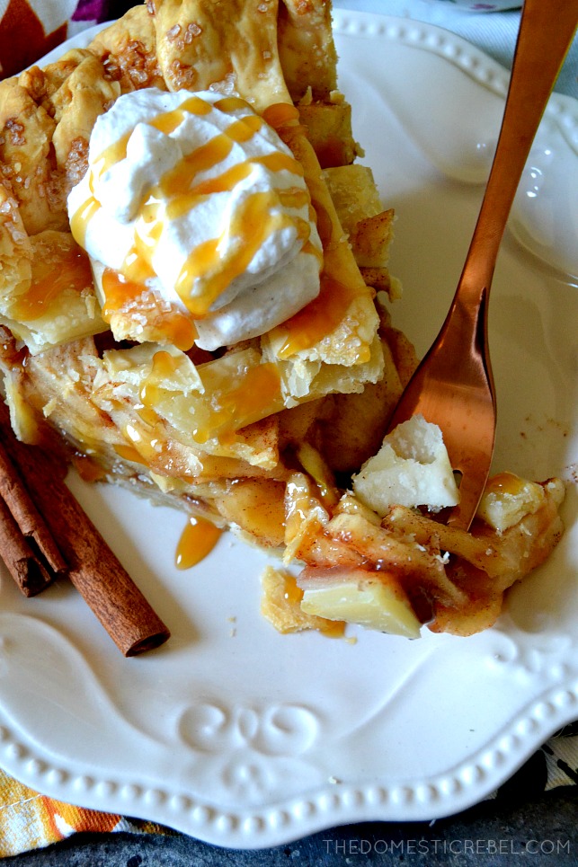 slice of apple pie with a bite on a fork