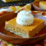 These SUPER EASY Pumpkin Cheesecake Bars taste like a cross between creamy cheesecake and gooey pumpkin pie! They come together in minutes and are SO delicious, impressive, and perfect!