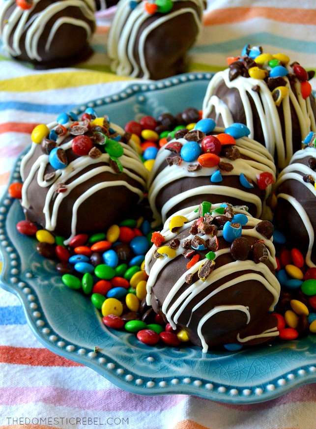 brownie bombs arranged on a blue plate with mini M&M's