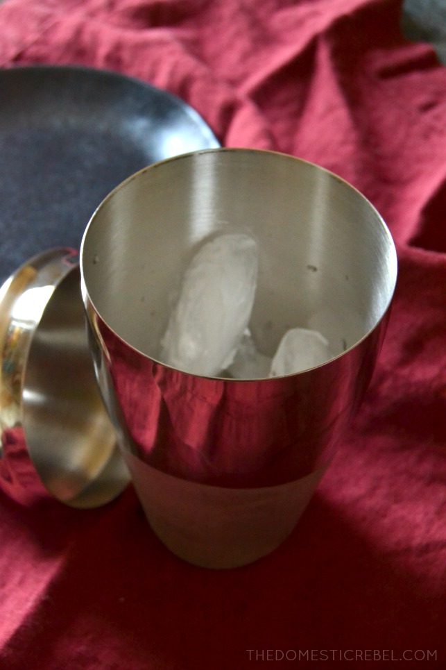 silver alcohol shaker with ice in it