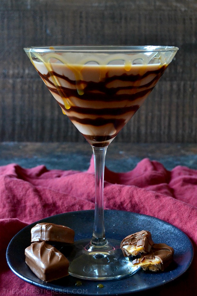 milky way martini sitting on a blue plate with chopped milky way candy bars