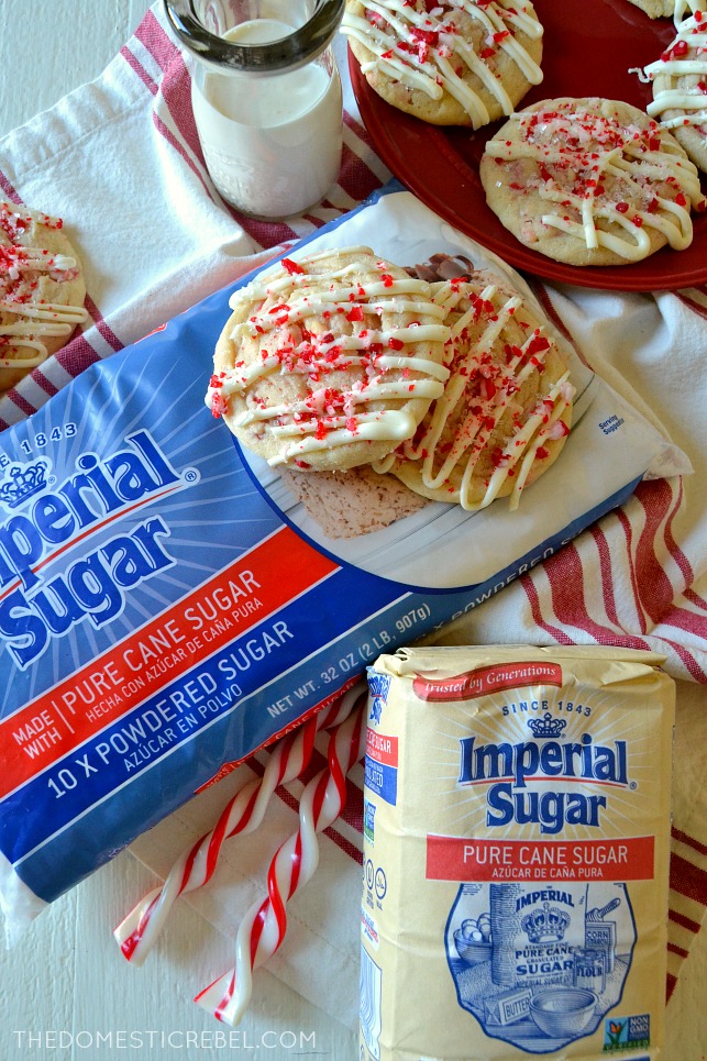 two peppermint sugar cookies sitting on top of a bag of Imperial Sugar 