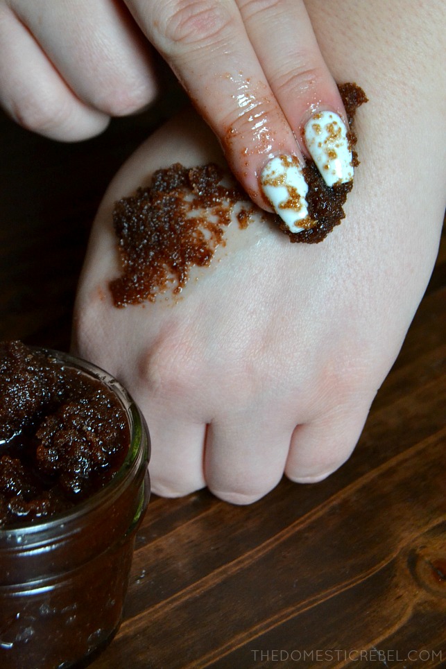 chocolate sugar scrub being spread on person's hand