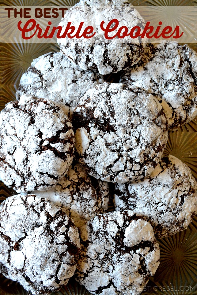 aerial view of chocolate crinkle cookies arranged on a gold sheet