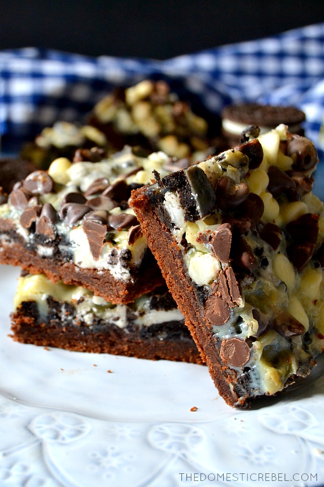 cookies and cream magic bar propped against two stacked magic bars 