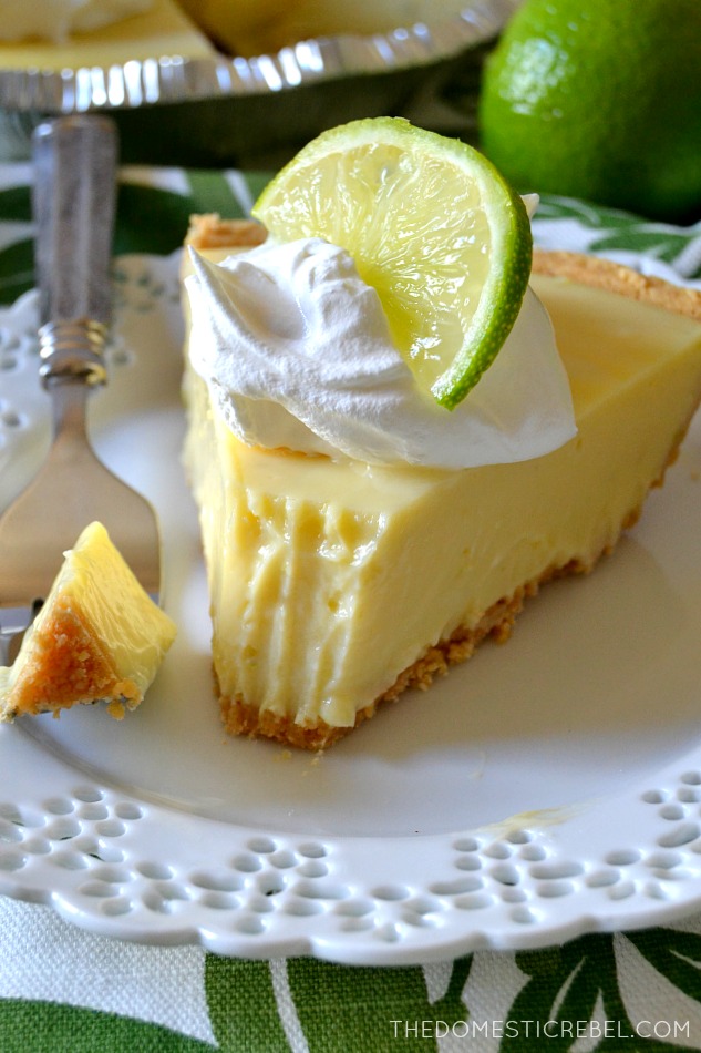 slice of key lime pie with a fork mark bite missing from it