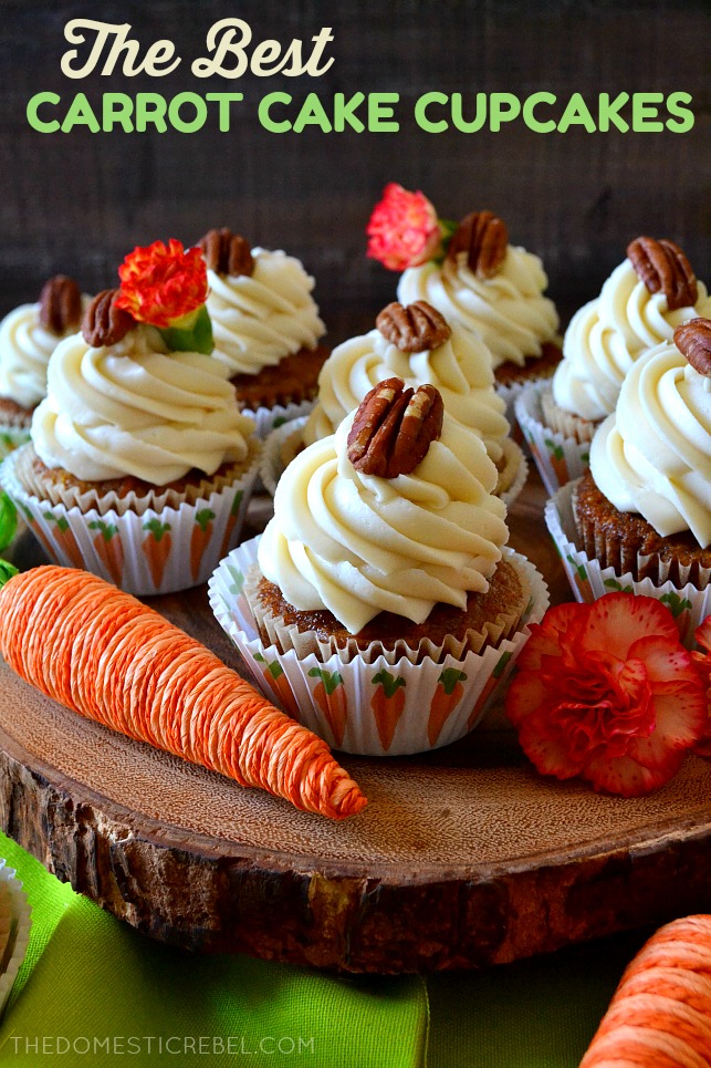 carrot cake cupcakes arranged on a wooden cake stand 