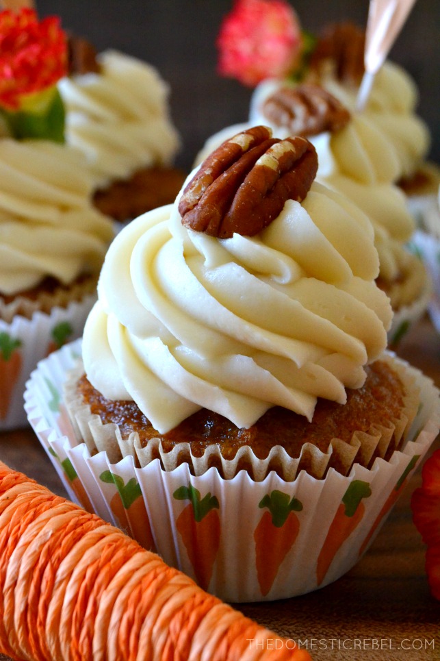carrot cake cupcake in a cupcake liner with illustrated carrots on it